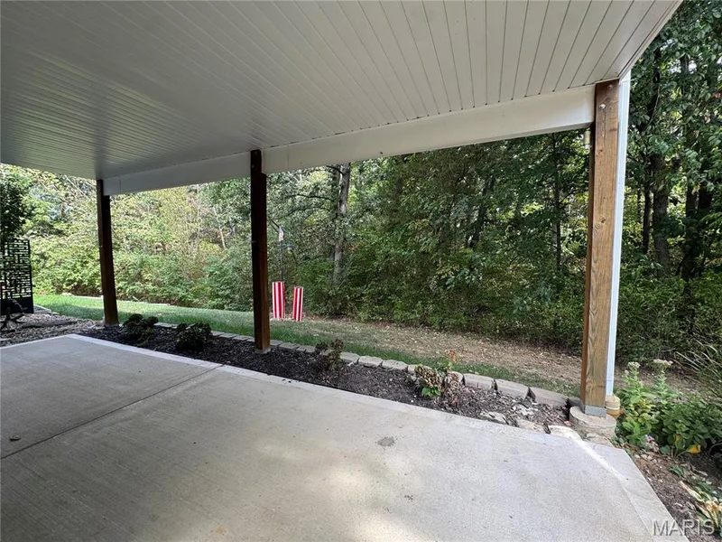 View from sliding glass door to woods — 32 Austin Hill Court, Wentzville, MO 63385