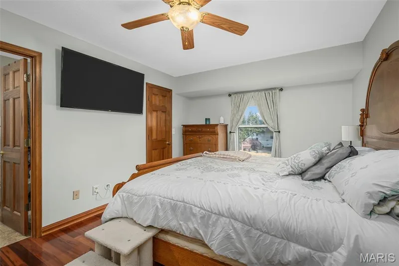 Wood-finish flooring with light wall tones and white trim — 355 Birmingham Drive, O'Fallon, MO 63366