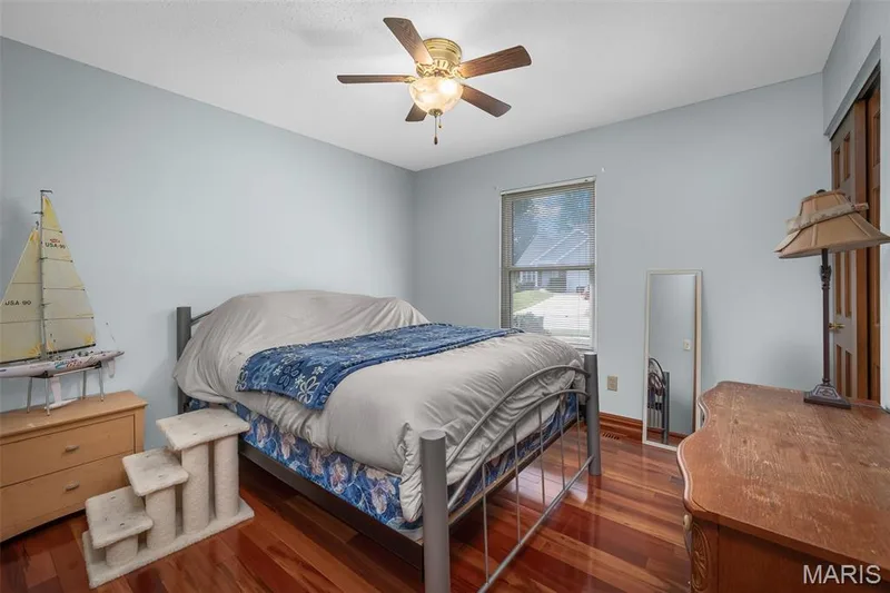 Wood-finish flooring with a ceiling fan light fixture — 355 Birmingham Drive, O'Fallon, MO 63366