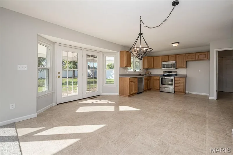 Convenient access to the covered patio and backyard — 117 Black Lantern Trail, St Peters, MO 63376