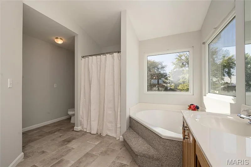 Separate tub and shower in the primary bathroom — 117 Black Lantern Trail, St Peters, MO 63376