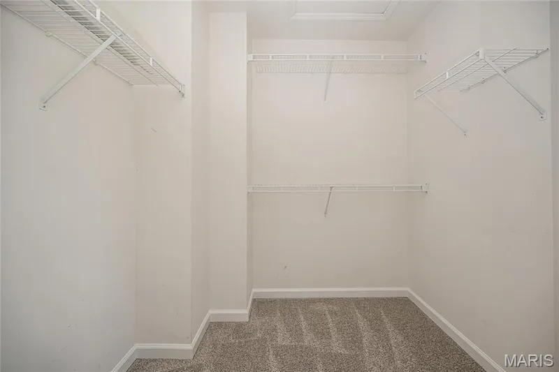 Primary bedroom features a walk in closet as well as a linen closet in the bathroom — 117 Black Lantern Trail, St Peters, MO 63376