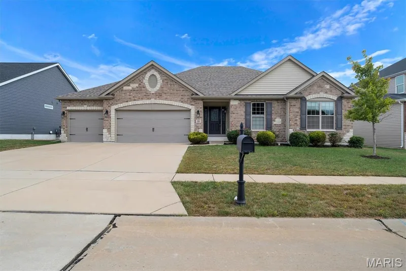 Brick veneer and siding exterior with decorative stone accents — 332 Mystic Brook Drive, O'Fallon, MO 63366