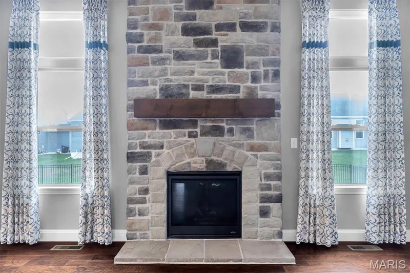 Stacked stone fireplace with an arched firebox — 332 Mystic Brook Drive, O'Fallon, MO 63366