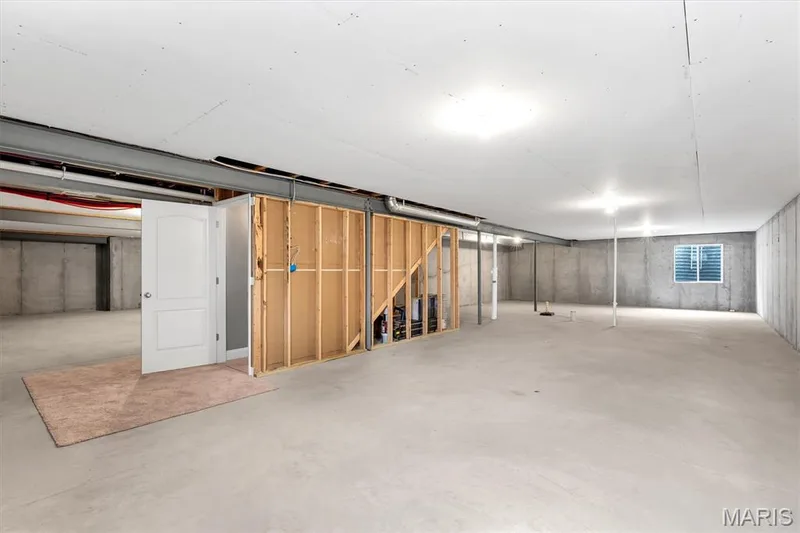 Expansive unfinished concrete flooring, exposed concrete walls, and a lower-level window — 332 Mystic Brook Drive, O'Fallon, MO 63366