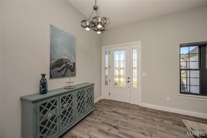 Notice the Front door details and one of the owner's prized works. — 121 Eagle Estates Drive, Lake St. Louis, MO 63367