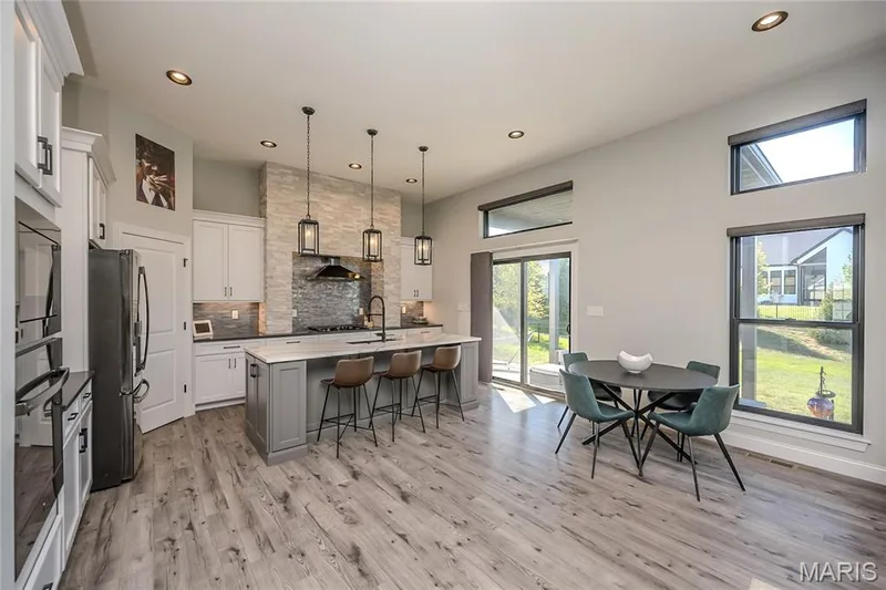 The door leads to the covered high ceiling patio that was designed to be the entrance to a pool paradise. — 121 Eagle Estates Drive, Lake St. Louis, MO 63367