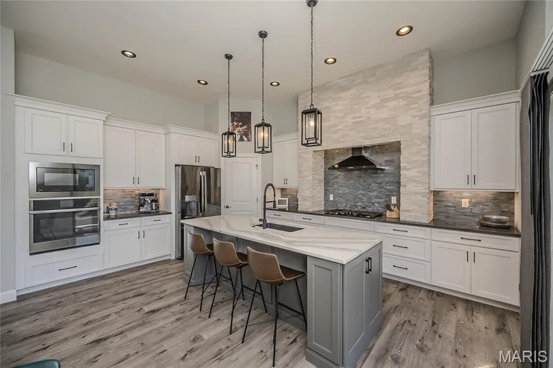 The artist/owner is not a chef and they have been rarely used.  Even he at first glance, could think he can cook.  Take out can easily fool the crowd. Nestled in the corner is the pantry. — 121 Eagle Estates Drive, Lake St. Louis, MO 63367