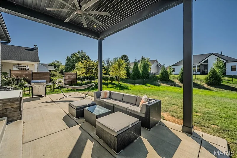 The large yard is totally fenced for enclosing the kids, the family soccer match, or controlling a wandering pet.  The owner designed the outdoor space for a future pool.  The sprinkler system will only have one zone moved for the pool of your dreams. — 121 Eagle Estates Drive, Lake St. Louis, MO 63367