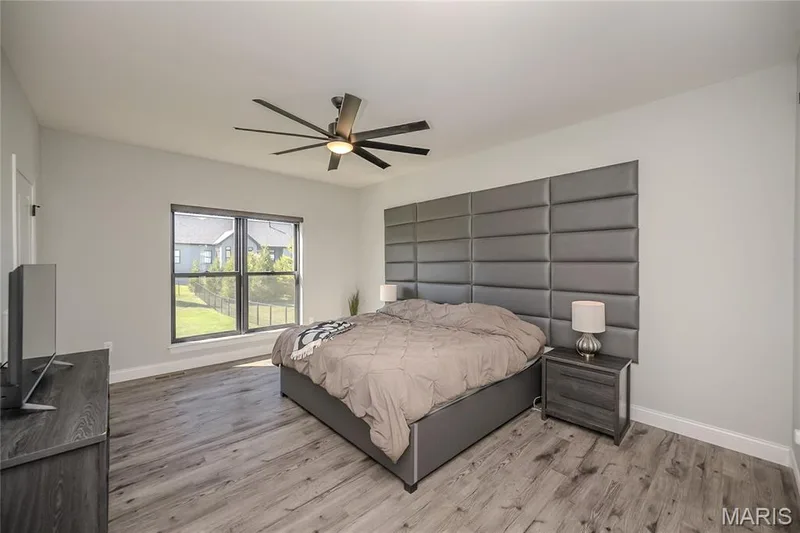 The Primary Bedroom also features the electronic window treatments. — 121 Eagle Estates Drive, Lake St. Louis, MO 63367