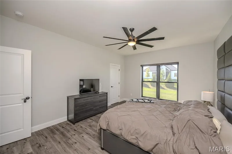 To the center of the photo is the door to one of two primary closets. — 121 Eagle Estates Drive, Lake St. Louis, MO 63367