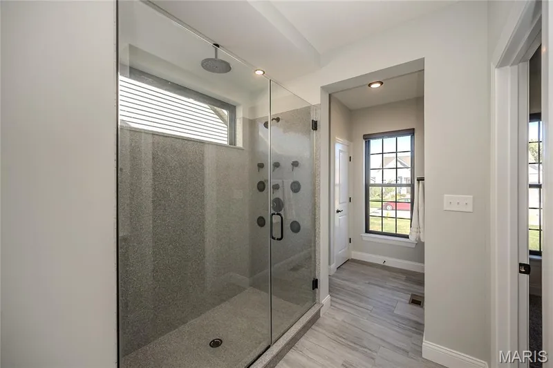 The magic shower features everything you would desire.  The gentle rain shower at center and not seen in the photo is the hand held wand that is handy for Fido or a quick touch up the glass.  4 controlled jets that let you wash away that stressful day. — 121 Eagle Estates Drive, Lake St. Louis, MO 63367