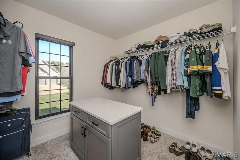 The largest of the primary closets, complete with an island. — 121 Eagle Estates Drive, Lake St. Louis, MO 63367