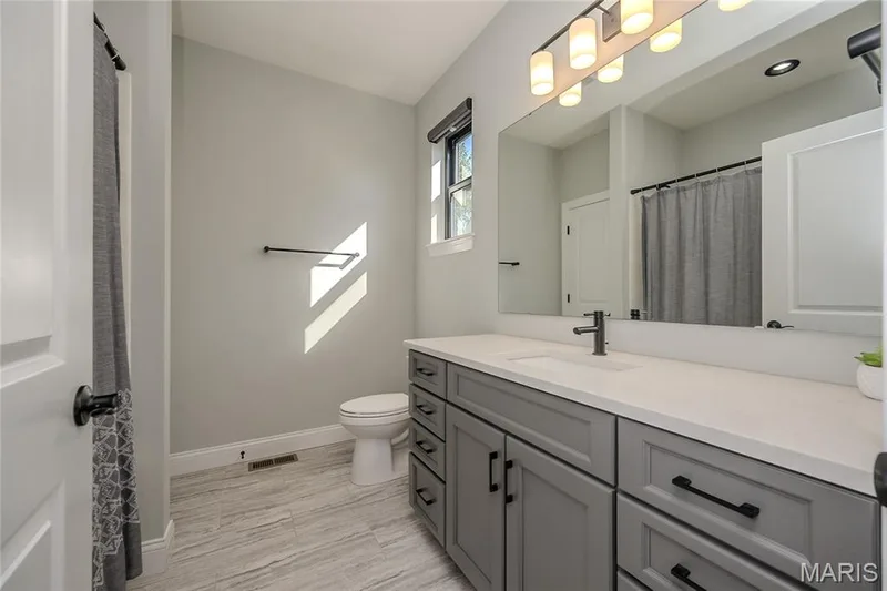 The ensuite, you need to be warned.  Not only is it a private bath, but it also stars a soaking whirlpool tub and shower combo.  Your guests may never leave or Grandma just found a new home. — 121 Eagle Estates Drive, Lake St. Louis, MO 63367