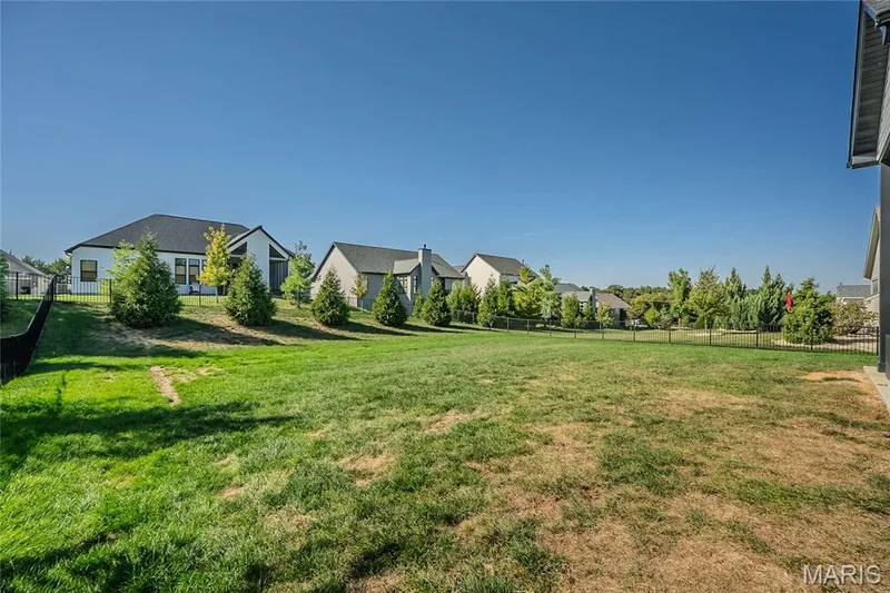 The owner has landscaped with mature evergreens. — 121 Eagle Estates Drive, Lake St. Louis, MO 63367