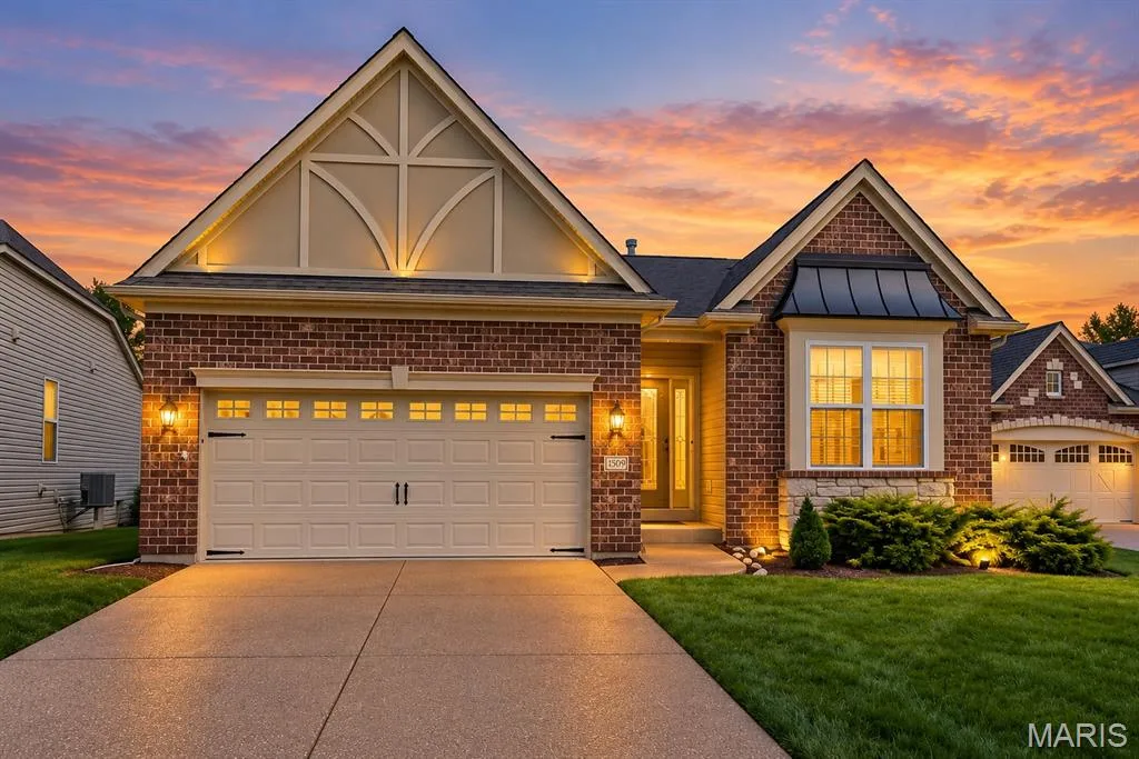 Brick exterior with decorative gables and a two-car garage — 1509 Woodside Hills Drive, St Peters, MO 63376