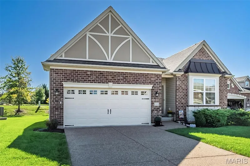 Brick exterior featuring a gabled roof and decorative trim — 1509 Woodside Hills Drive, St Peters, MO 63376