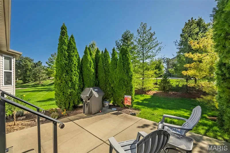 Poured concrete patio with metal railing — 1509 Woodside Hills Drive, St Peters, MO 63376