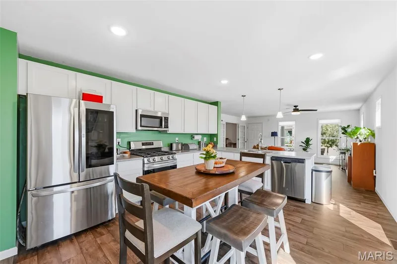 Spacious and inviting kitchen with tons of prep space and an open layout perfect for entertaining! — 6002 Suntan Drive, St Charles, MO 63301