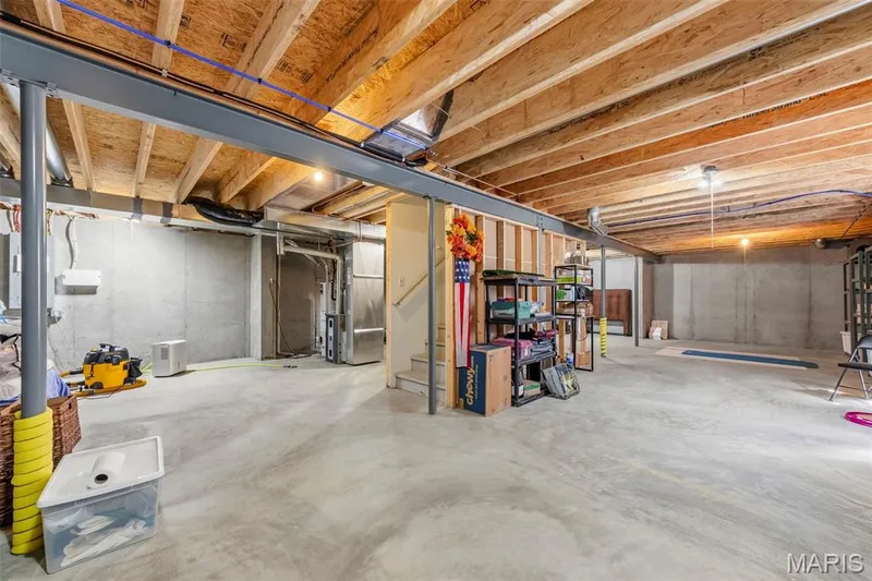So much room to grow! With an egress window and bathroom rough-in already in place, imagine a future family room, guest suite, home gym, or entertainment space. The possibilities are yours! — 6002 Suntan Drive, St Charles, MO 63301