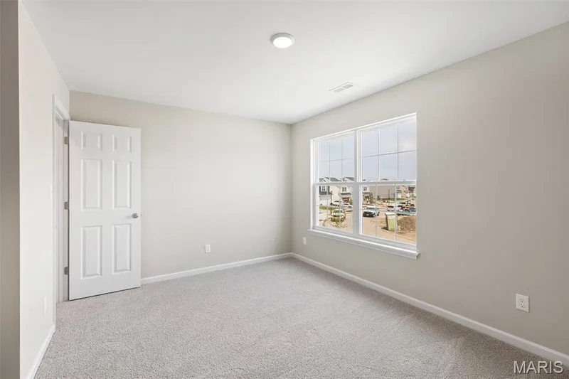 View of carpeted spare room — 2 Burlington at Fairmount Grove, St Peters, MO 63376