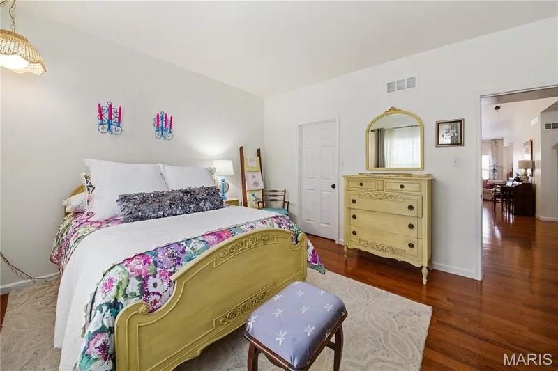 Hardwood flooring throughout, white walls, and a white six-panel door — 149 Amiot Court, Chesterfield, MO 63146