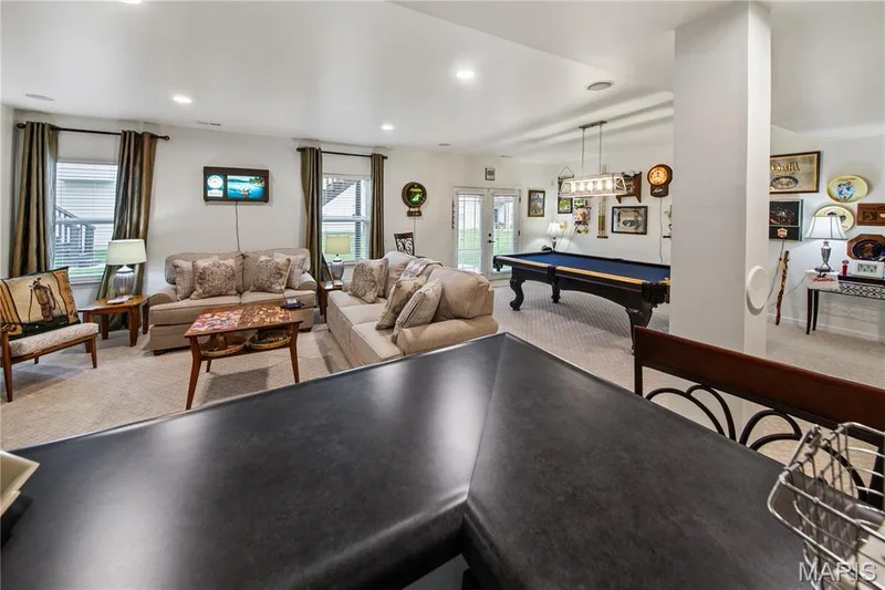 Expansive lower-level space featuring recessed lighting, carpeted flooring, and a walk-out to the exterior — 149 Amiot Court, Chesterfield, MO 63146