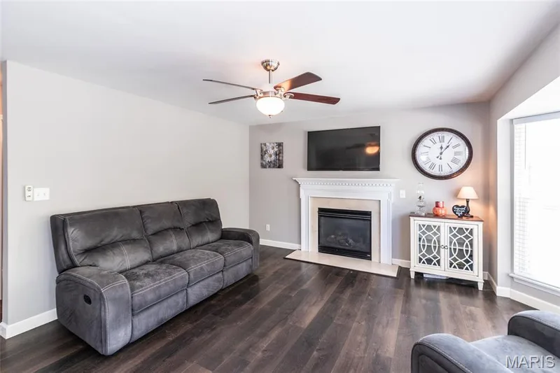 Main floor family room with Fireplace & bay window. — 232 Spring Borough Drive, O'Fallon, MO 63368