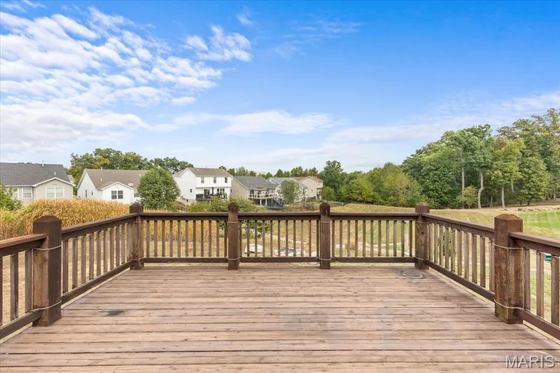 Expansive wood deck with a full-height railing — 521 Cimarron Woods Court, Wentzville, MO 63385