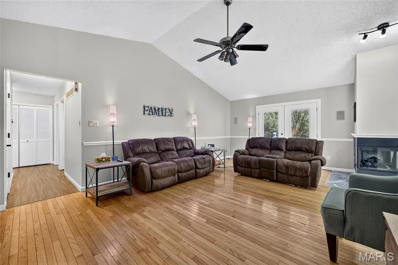 There are two doors leading out to the deck, which also allows for natural light to flow in. — 2335 Federalist Place, O'Fallon, MO 63368