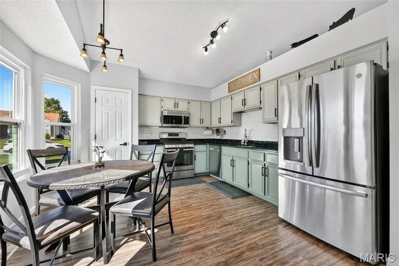 Tons of cabinet space and a pantry make for wonderful storage space! — 2335 Federalist Place, O'Fallon, MO 63368