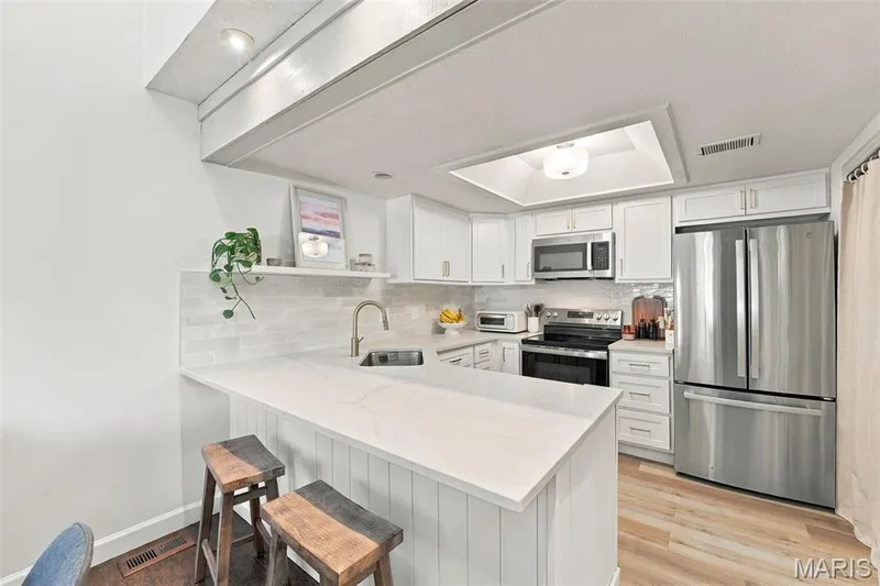 Brand new kitchen. Quartz countertops, shaker cabinets, stainless appliances. — 103 Hemingway Lane #B, Weldon Spring, MO 63304