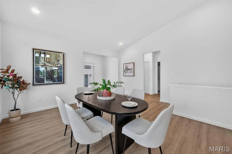 Vaulted ceiling with recessed lighting, LVP flooring, and white painted walls — 2974 Memphis Street, St Charles, MO 63301