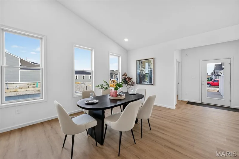 Vaulted ceiling, recessed lighting, LVP flooring, white walls, and multiple windows — 2974 Memphis Street, St Charles, MO 63301