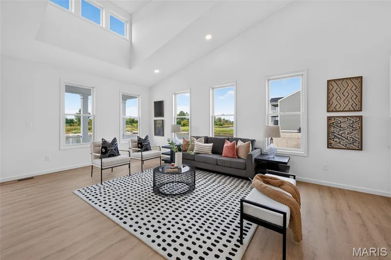 Vaulted ceilings, recessed lighting, and LVP flooring — 2974 Memphis Street, St Charles, MO 63301