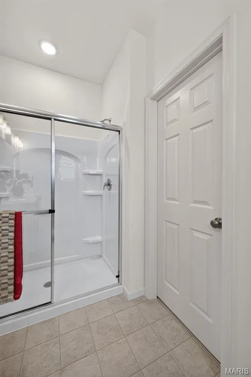 walk-in shower featuring a glass enclosure — 2974 Memphis Street, St Charles, MO 63301
