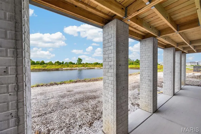 Walk out lower level to large concrete patio overlooking water view — 2974 Memphis Street, St Charles, MO 63301