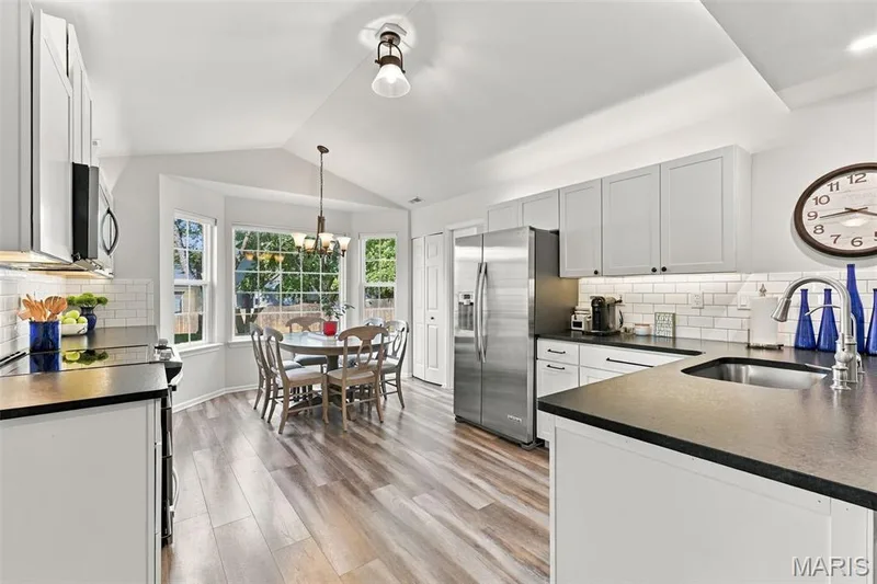 The Updated Kitchen includes a nice Dining Bay window which enjoys a lovely view! — 14 Quiet Meadow Court, St Peters, MO 63376
