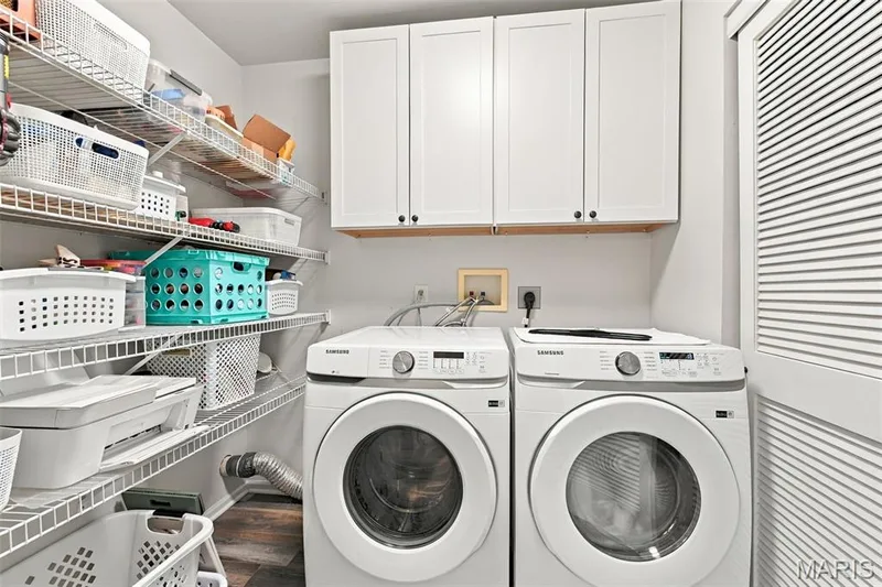The spacious Laundry Room included both Washer & Dryer! Note the wall cabinets and shelving! — 14 Quiet Meadow Court, St Peters, MO 63376