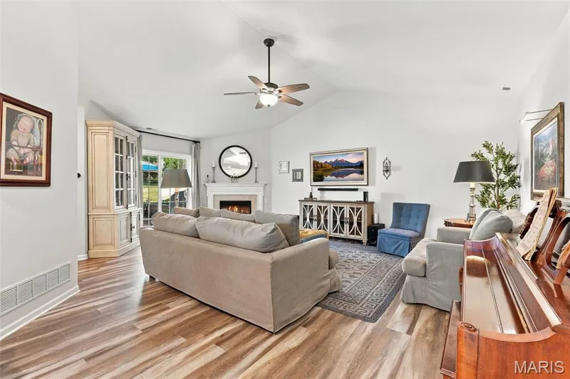 The Vaulted Great Room and Kitchen offers a bright and cheerful setting! — 14 Quiet Meadow Court, St Peters, MO 63376