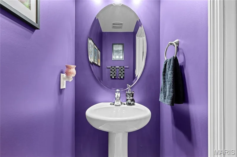 Pedestal sink with chrome faucet, oval wall mirror, and recessed lighting — 200 Tiber Way, St Charles, MO 63301