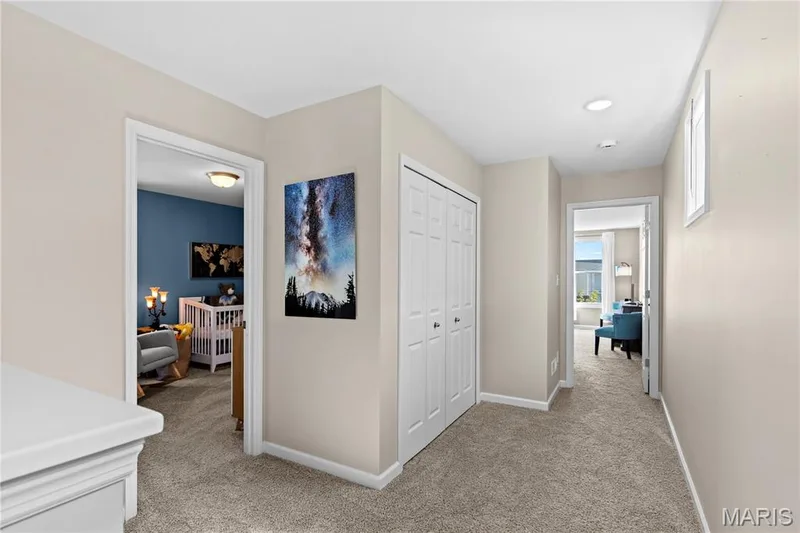 Hallway featuring neutral-toned walls, recessed lighting, and soft carpeting — 200 Tiber Way, St Charles, MO 63301