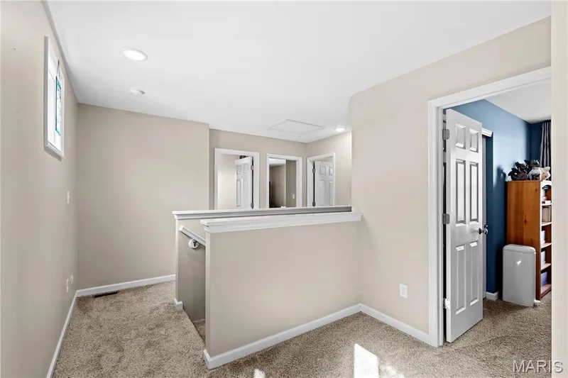 Upper landing featuring recessed lighting, a neutral color palette, paneled doors, and carpet flooring — 200 Tiber Way, St Charles, MO 63301