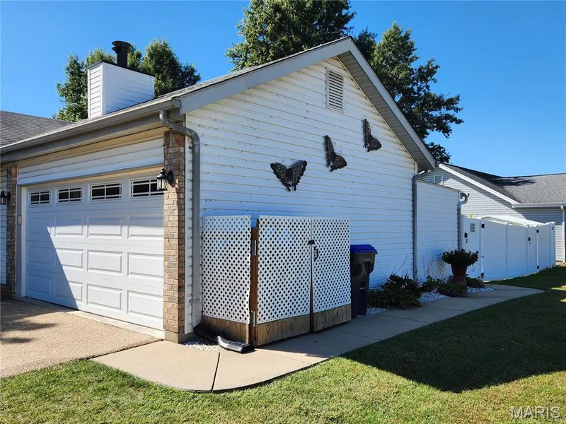 Two-car garage with paneling and transom windows — 101 Eric Craig Court, St Peters, MO 63376