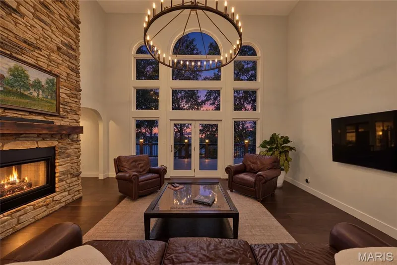 Great room with stunning sunset views over the lake — 713 High Point Drive, Lake St. Louis, MO 63367