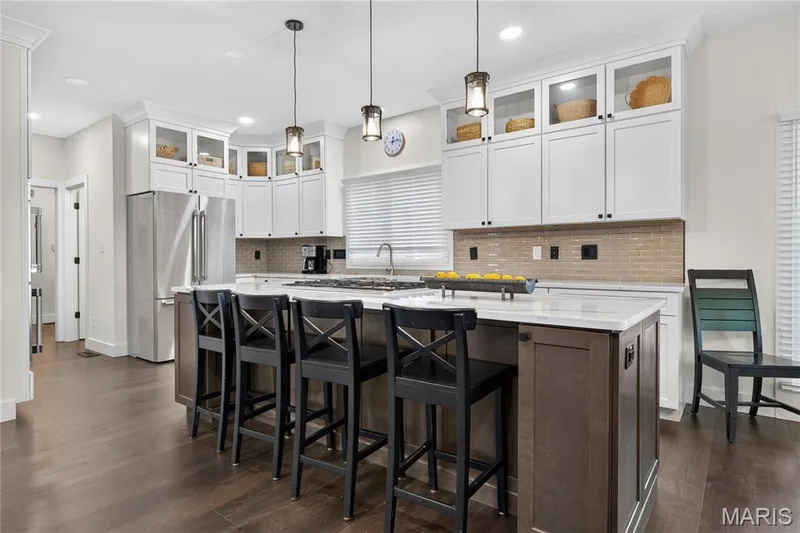Big center island with Thermador gas down draft — 713 High Point Drive, Lake St. Louis, MO 63367