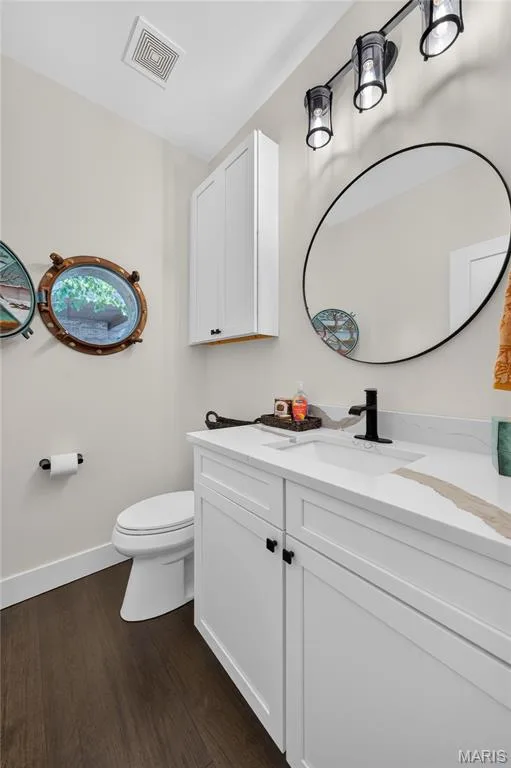 Powder room with porthole window — 713 High Point Drive, Lake St. Louis, MO 63367