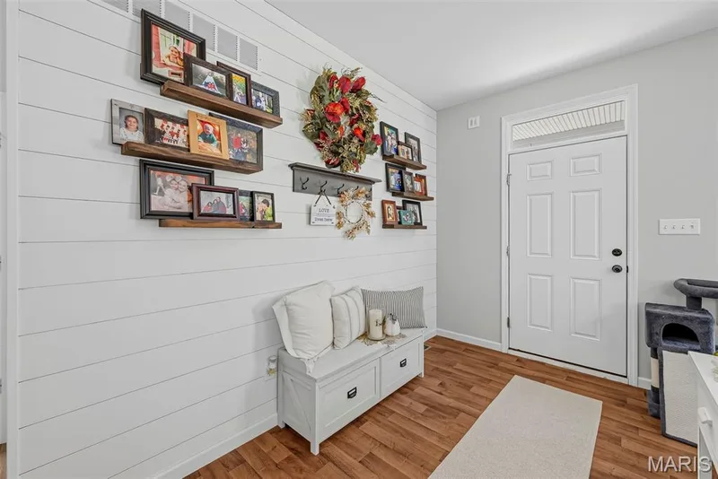 Custom shiplap wall at entry with shelving — 101 Starry Night Way, St Charles, MO 63301