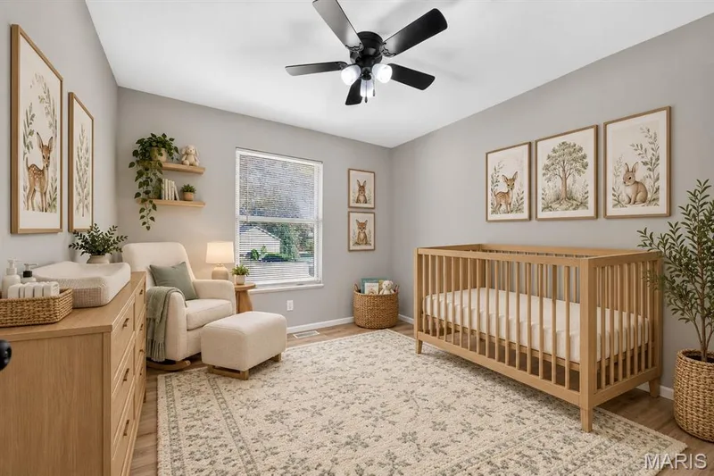 Vaulted ceiling with a ceiling fan, light wood-finish flooring, and a window with natural light — 341 Westbrook Drive, O'Fallon, MO 63366