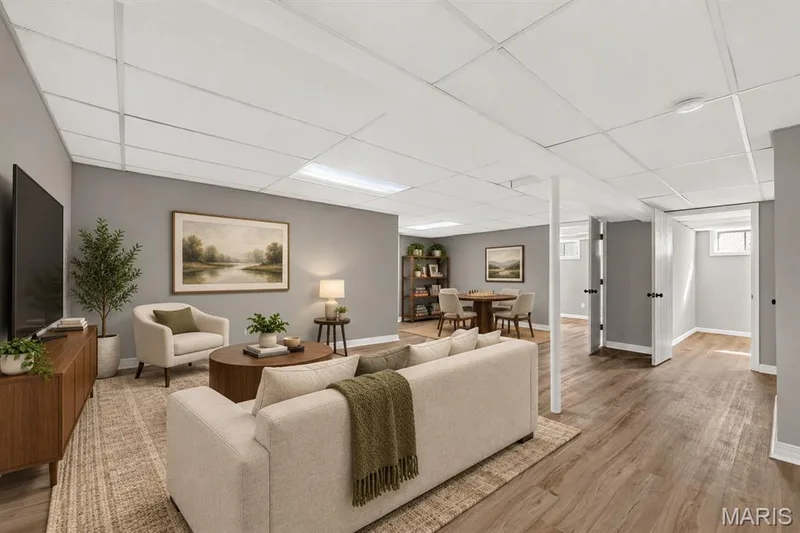 Wood-finish flooring throughout, complemented by light gray walls — 341 Westbrook Drive, O'Fallon, MO 63366